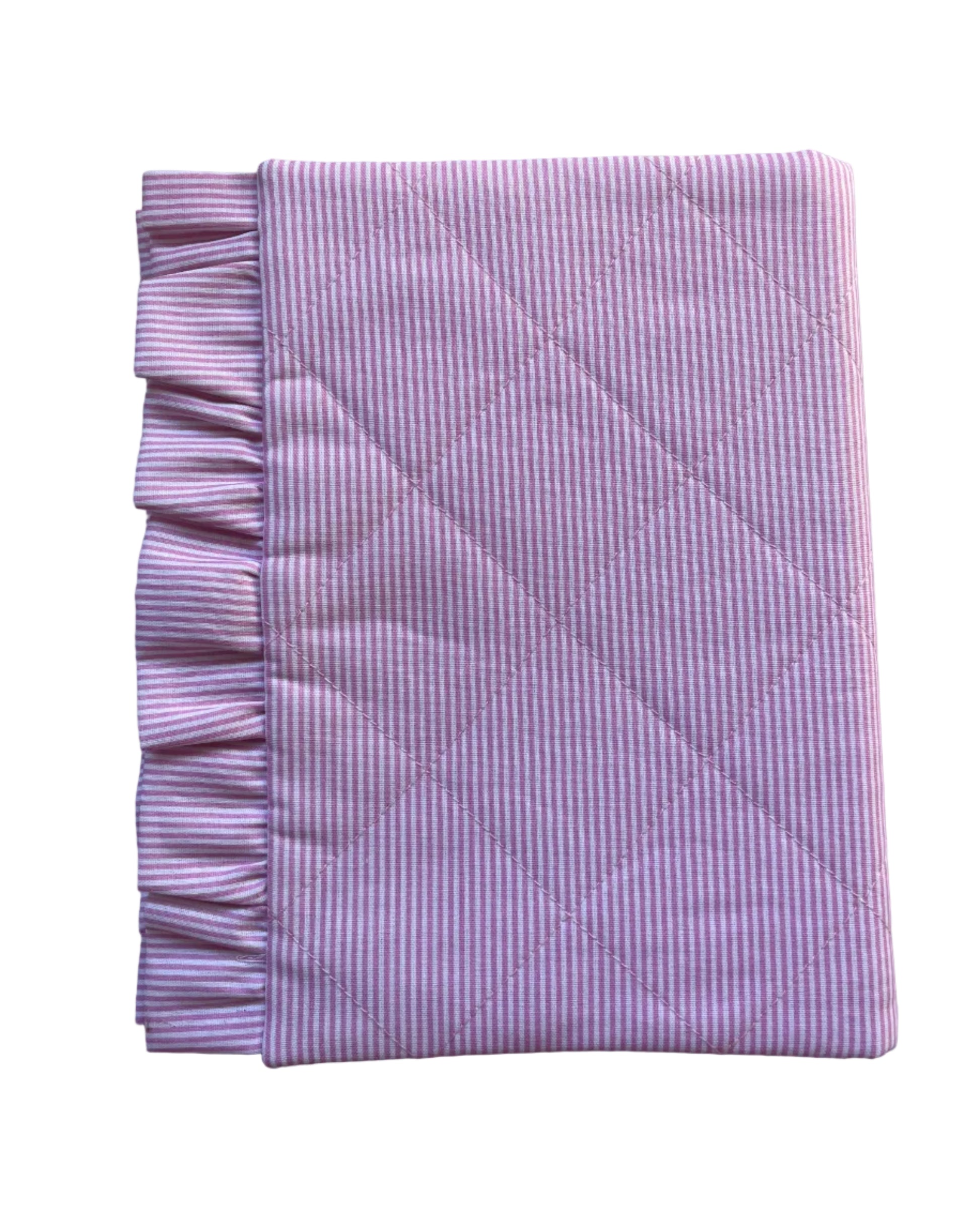 A folded pink and white striped quilted blanket with a ruffled edge, displayed on a white background.